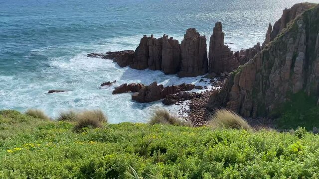 4k video of The Pinnacles located at Cape Woolamai coastal walk on Phillip Island.  The Pinnacles are a spectacular set of naturally formed colonnades on the rugged Victorian coastline.