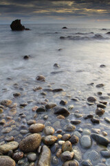 Scenic view on sunset at Batu Layar beach, Ambon island, Maluku, Indonesia