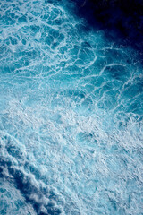 Aerial view to waves in ocean Splashing Waves. Blue clean wavy sea water