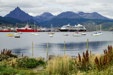 Modern cruise ship, cruiseship liner or expedition vessel ship in port of Ushuaia, Argentina with...
