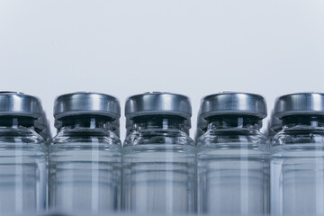 Glass medical ampoule vial for injection. Medicine is dry white drug penicillin powder or liquid...