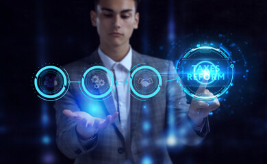 Business, Technology, Internet and network concept. Young businessman working on a virtual screen of the future and sees the inscription: Taxes reform