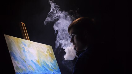 Artist copyist paint seascape with ship in ocean. Vaper smoke vape e-cigarette. Craftsman decorator draw as boat sail on blue sea with acrylic oil color. Draw finger, brush, knife palette. Indoor.