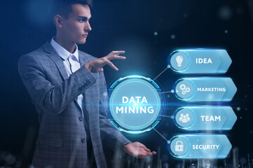 Business, Technology, Internet and network concept. Young businessman working on a virtual screen of the future and sees the inscription: Data mining