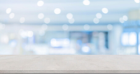 abstract blurred inside interior of modern hospital background with concrete texture tabletop for...