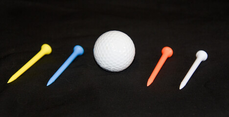 golf ball and colorful tee