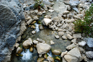 Naklejka na ściany i meble mountain river with stones below