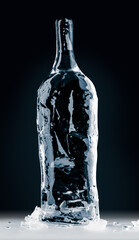 Bottle form, made of clean, transparent, natural ice on reflective surface on black background....