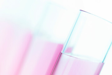 test tubes with pink liquid close up