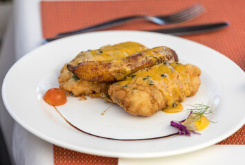 Espada fillet in batter and baked banana