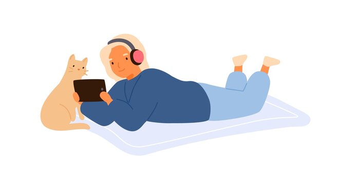 Child in headphones lying on the floor with cute cat and watching movie on tablet together. Cozy home scene with girl relax with lovely kitten. Flat vector cartoon isolated illustration on white.