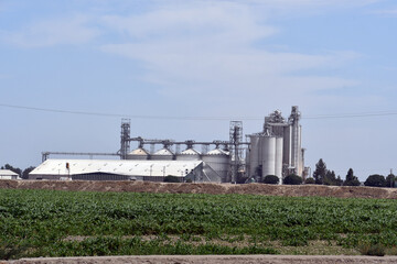Closeup shot of a big industrial factory under a blue sky