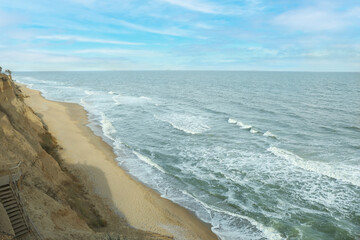 Sea with waves on beautiful sandy beach