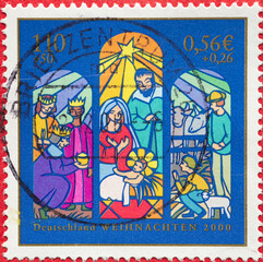GERMANY - CIRCA 2000: a postage stamp from Germany, showing a window picture with the birth of Christ, the three kings, the shepherds. Christmas postal stamp