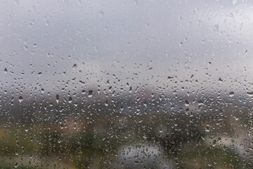 Rain drops on the window texture and clean window. Rainy day Drops on glass background