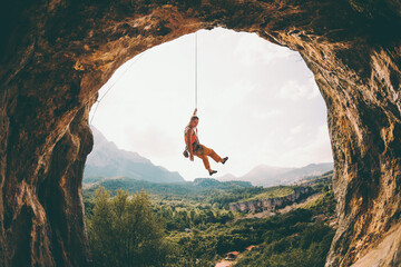 Rock climber hanging on a rope.