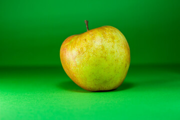 Apple on a green background