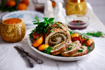 Turkey porchetta with caramelised clementines on the Christmas background .style rustic.