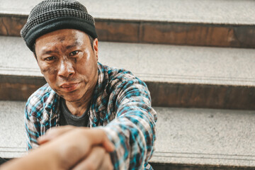 Asia Senior homeless man on walkway street in the city.	
