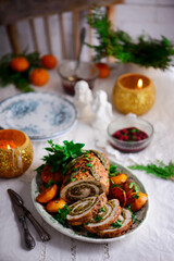 Turkey porchetta with caramelised clementines on the Christmas background .style rustic.