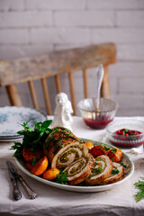 Turkey porchetta with caramelised clementines on the Christmas background .style rustic.