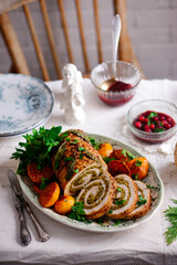 Turkey porchetta with caramelised clementines on the Christmas background .style rustic.