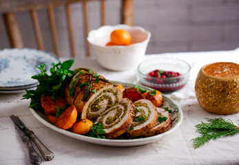 Turkey porchetta with caramelised clementines on the Christmas background .style rustic.
