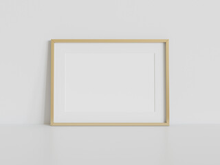 Golden frame leaning on white floor in interior mockup. Template of a picture framed on a wall 3D rendering