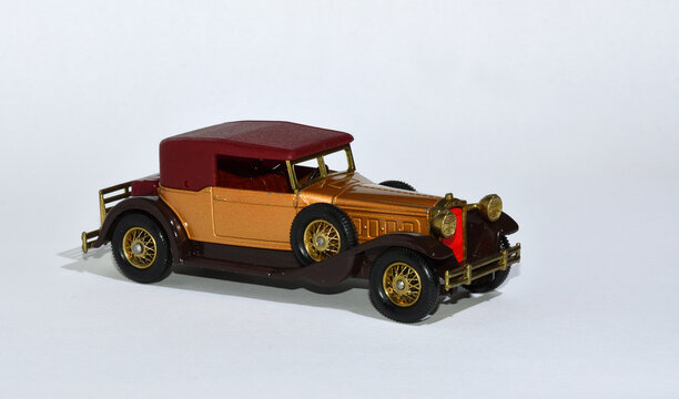 Toy diecast model car 1930 Packard Victoria a Matchbox yesteryear product by Lesney with white background.