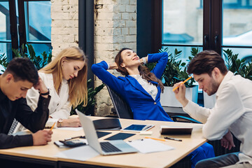 Businesswoman relax while her colleagues working