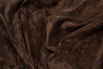 Velour fabric brown background texture. Textile brown top view