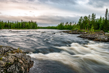 Stormy rapids river against a stormy sky