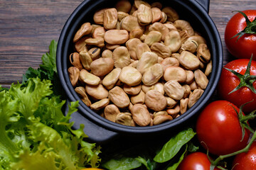 various vegetables background. vicia faba beans, tomatoes. Health vegan and vegetarian food concept. Foods high in antioxidants, fiber, smart carbohydrates and vitamins. Top view