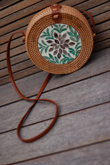 ladies handbag made of straw and wood
