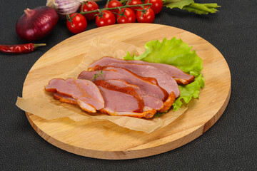Sliced smoked duck breast served salad