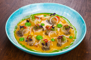Scallops with sauce and chili