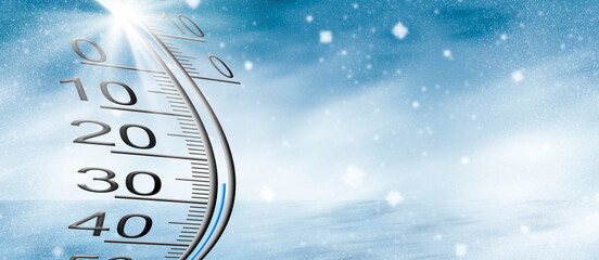 Thermometer on snow shows low temperatures in celsius or farenheit.