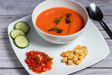 Gazpacho with croutons, peppers and cucumber decoration