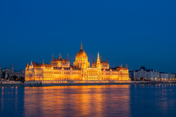Fototapeta na wymiar Budapest parliament on the Danube banks at dusk, Hungary