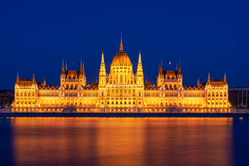 Fototapeta na wymiar Budapest parliament on the Danube banks at dusk, Hungary