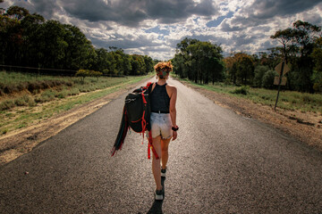 Solo female traveller walking on the road