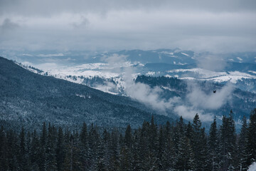 Snowy mountains and amazing sky with clouds in the winter mountains. Background.