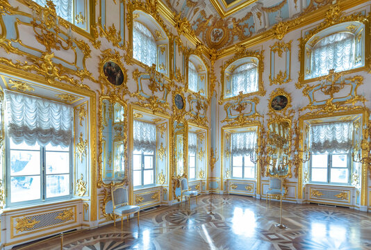 Peterhof , Saint Petersburg, Russia - 16 November, 2019: Interior of Peterhof Palace, commissioned by Peter the Great. Amazing room, walls and ceiling decorated with baroque gold ornaments