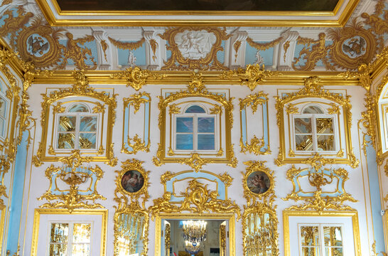 Peterhof , Saint Petersburg, Russia - 16 November, 2019: Interior of Peterhof Palace, commissioned by Peter the Great. Amazing room, walls and ceiling decorated with baroque gold ornaments