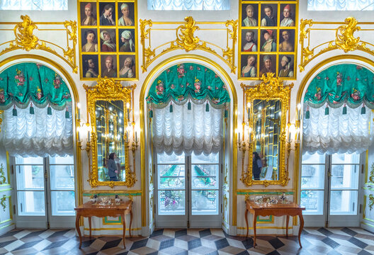 Peterhof , Saint Petersburg, Russia - 16 November, 2019: Interior of Peterhof Palace, commissioned by Peter the Great. Amazing room, walls and ceiling decorated with baroque gold ornaments