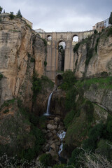 Cityscape of Ronda in Spain with Cliffs, Bridge, Andalusian Houses and Waterfall