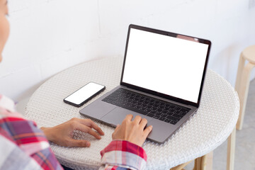 computer,cell phone mockup.hand woman work using laptop texting mobile.blank screen with white background for advertising,contact business search information on desk in cafe.marketing,design