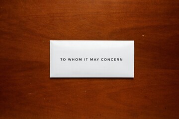A picture of envelope written to whom it may concern on the table. Resignation concept.