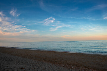 Panoramic view of the sea beach in sunset light.