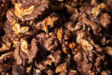 Dry walnut. Closeup of big shelled walnuts pile. Nuts background